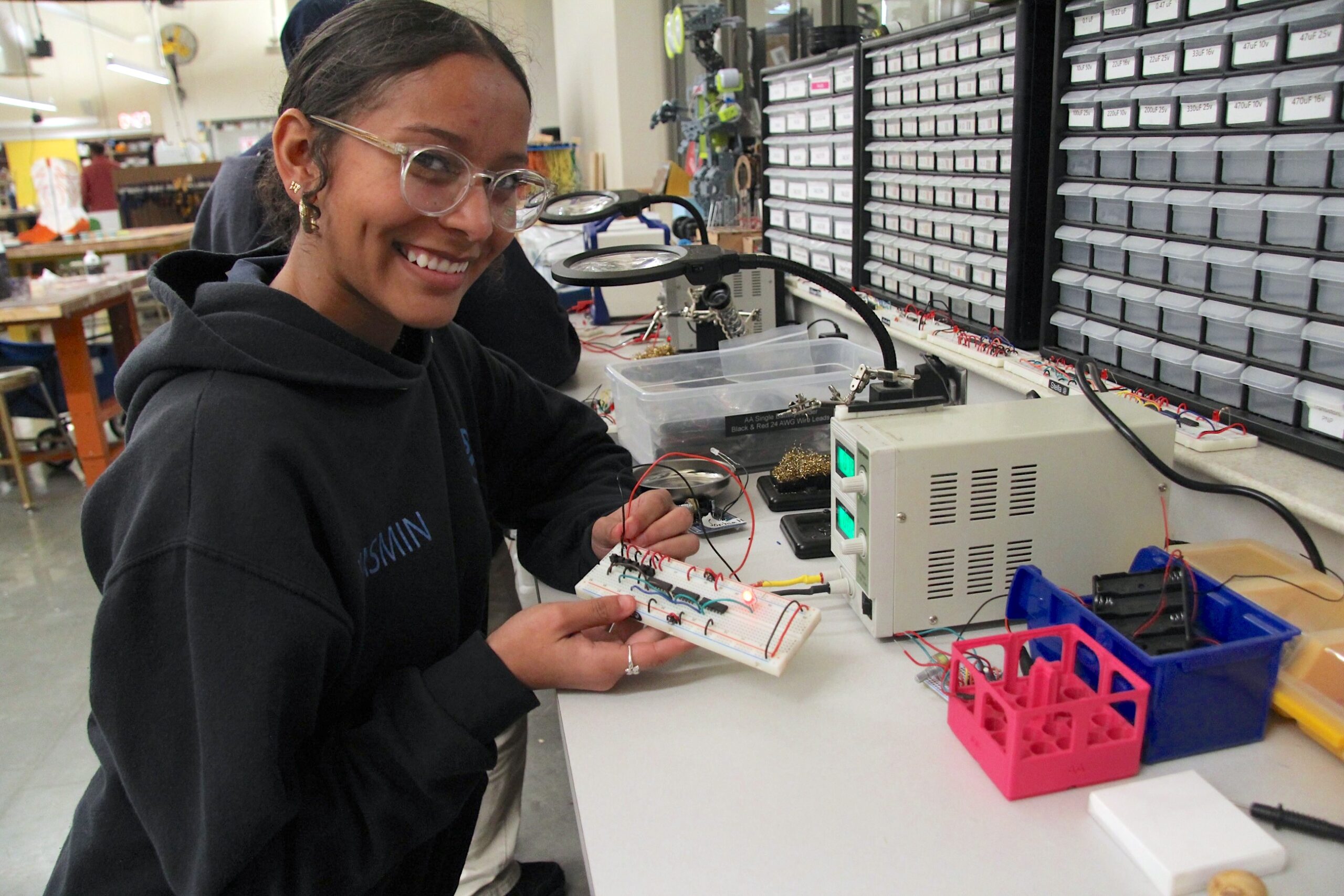 Student assembling an electronics project